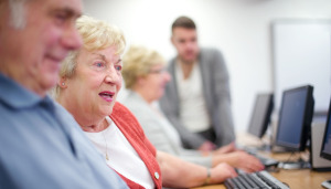 People being sown how to use computers