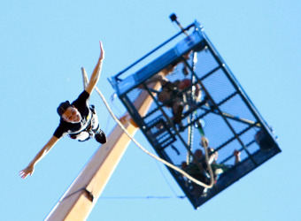 Fundraiser Gemma bungee jumps from a tall platform
