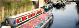 A group of canal boats on a body of water