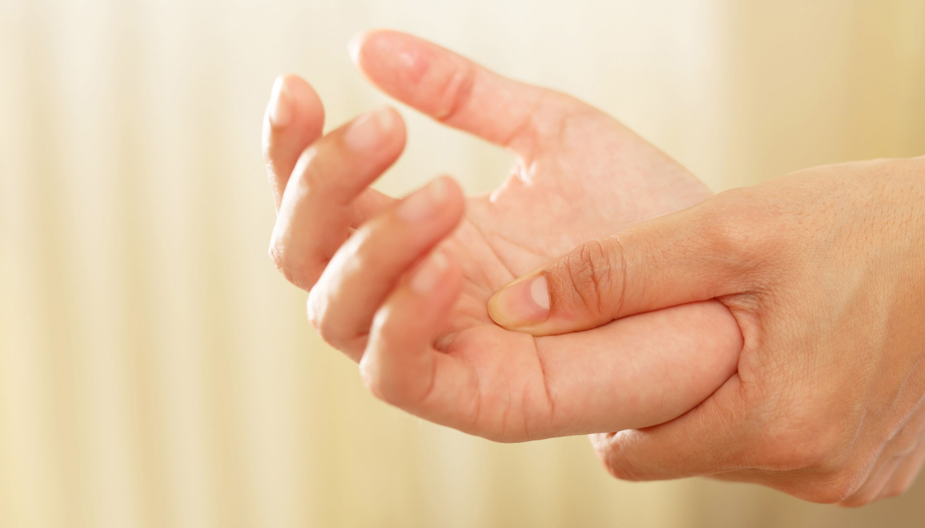 A hand being rubbed by another hand