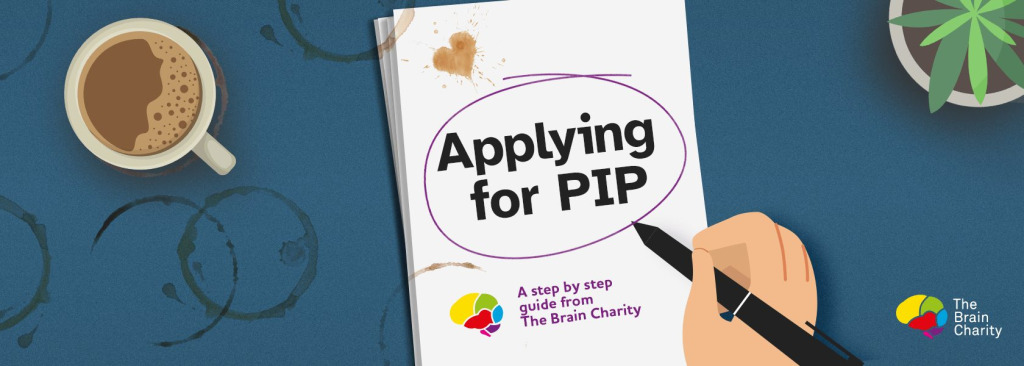 A notepad with the words Applying for PIP. A cartoon hand holding a pen has circled the title. There are coffee stains on it indicating all the hard work that has been put in to the application.