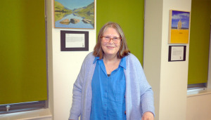 Christine, a middle-aged woman in a cardigan, on a visit to The Brain Charity